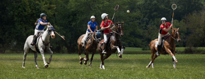 Polocrosse players passing a ball in Northern VA.