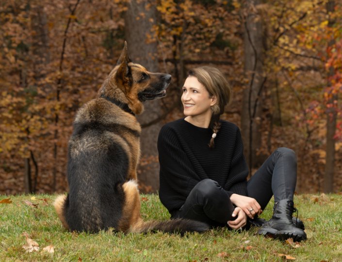 Woman and German Shepherd Sitting Outside | Fairfax County Woman sitting in the grass looking at her German Shepherd.